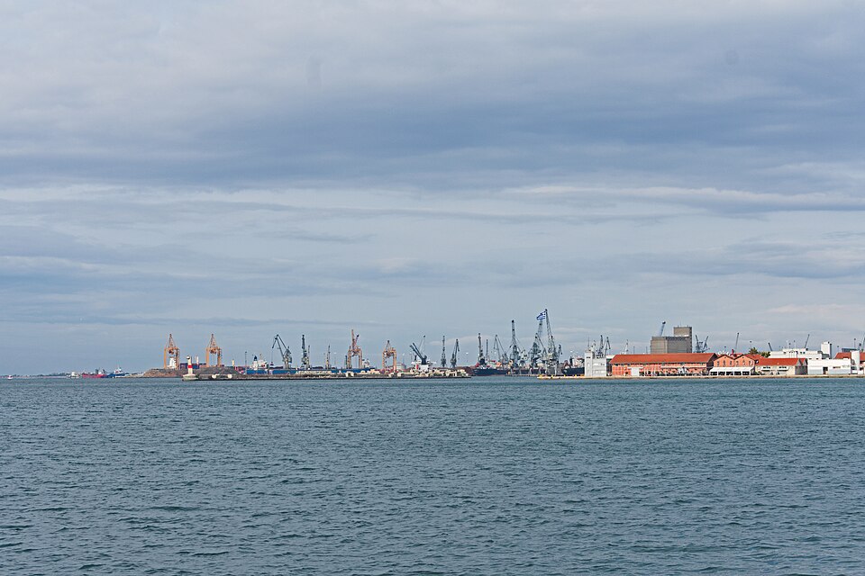 The Port of Thessaloniki seen across the bay, with container and harbour cranes on the skyline