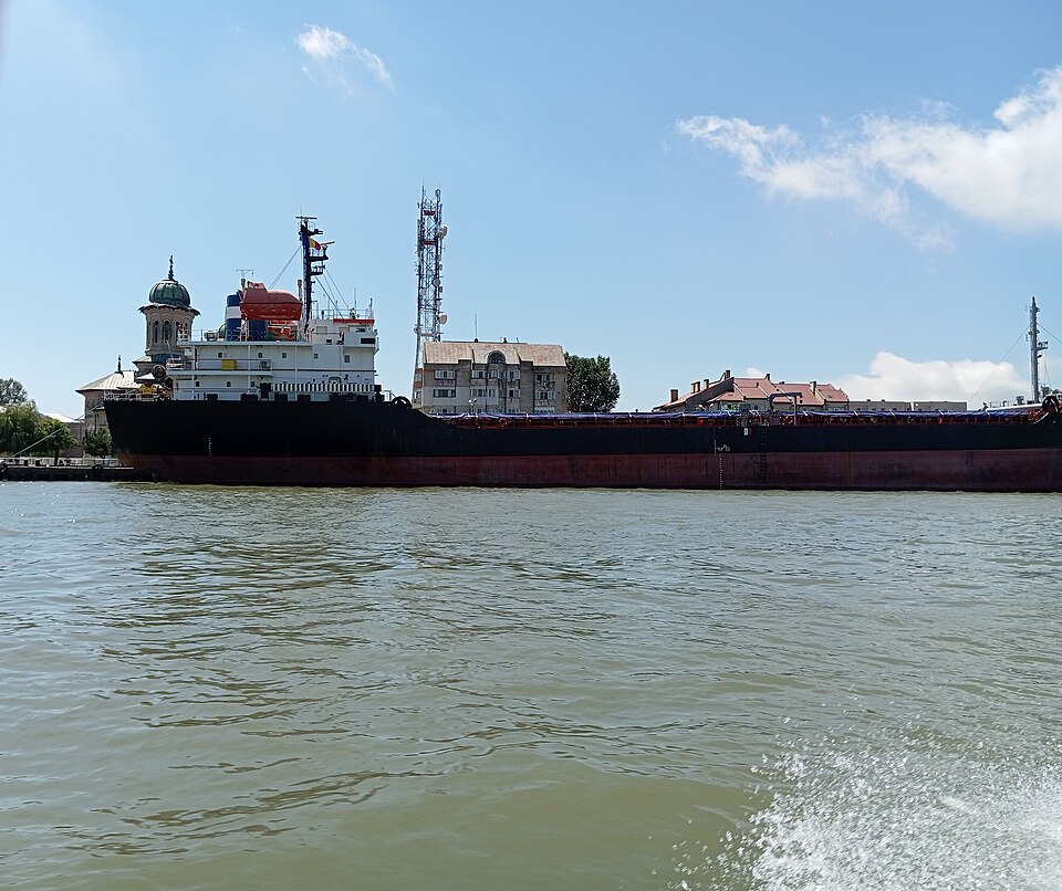 A loaded cargo ship moored on the Sulina branch of the Danube at Sulina, Romania