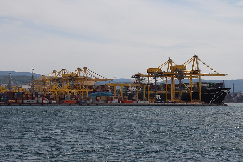 Container cranes working a ship at the Port of Trieste
